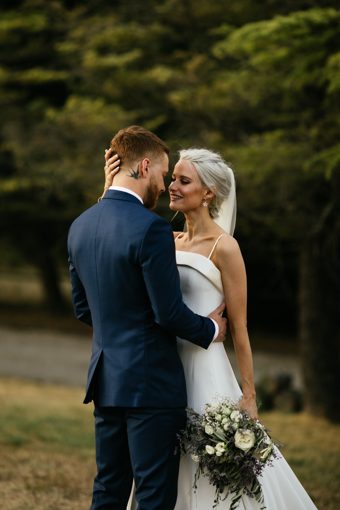 Victoria Magrath of inthefrow stands looking at her new husband in a Phillipa Lepley wedding gown on their wedding day.